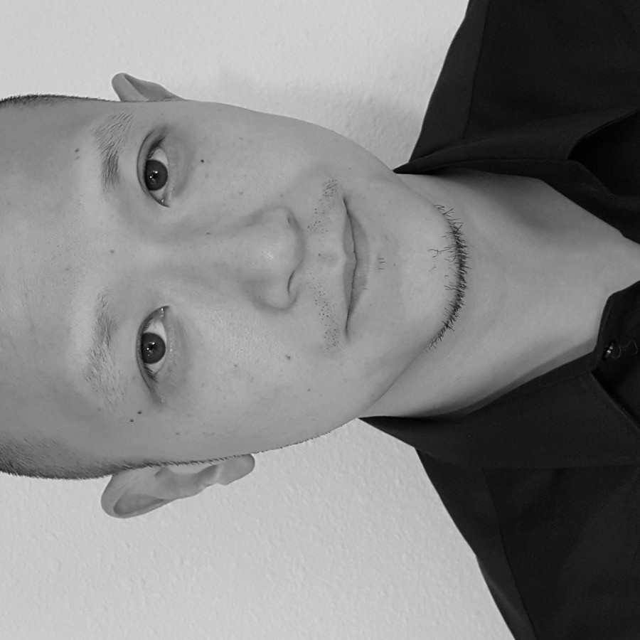 Rudy Chou in profile with blurred office backdrop